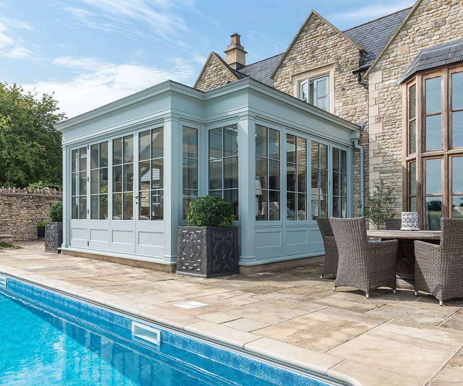 Orangery and outdoor pool in summer