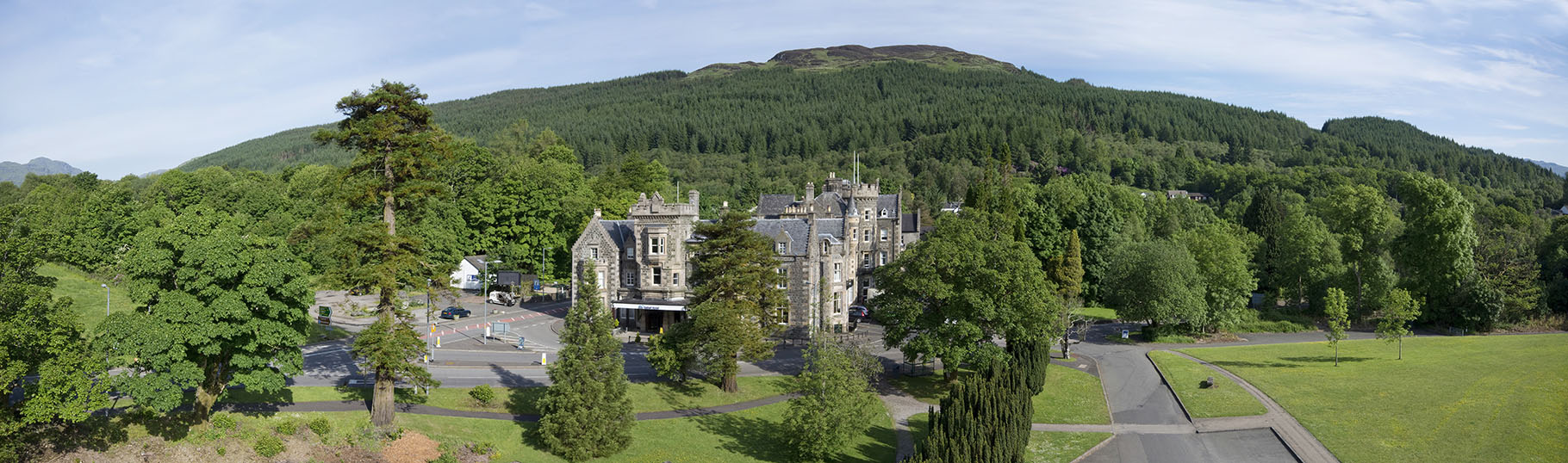 Hotel exterior amongst trees taken from a mast at elevation