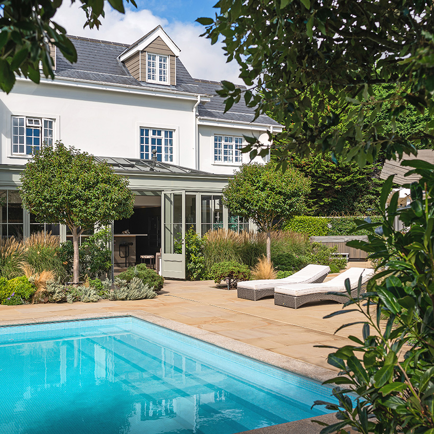 Residential property with orengery taken in summer overlooking a pool