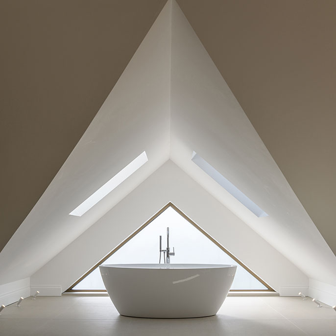 Interior detail of a bathroom with triangular window