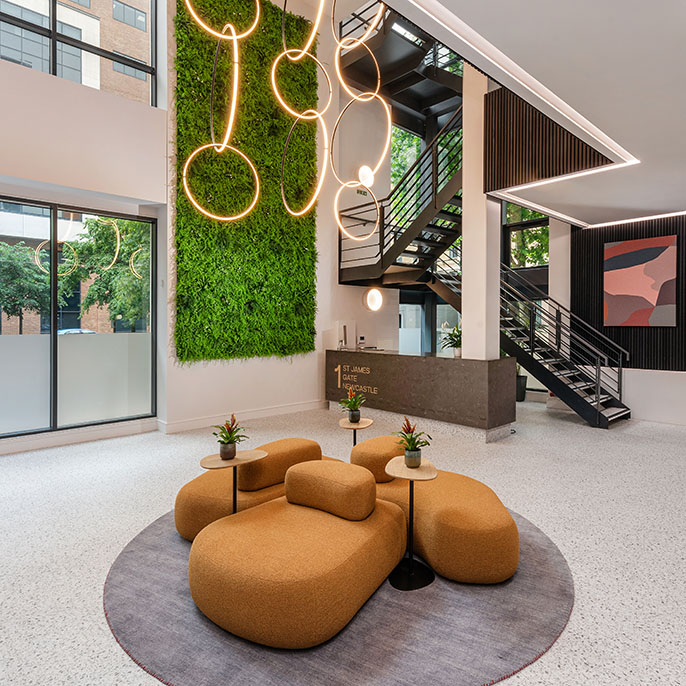 Interior of a office reception area with furniture and lighting