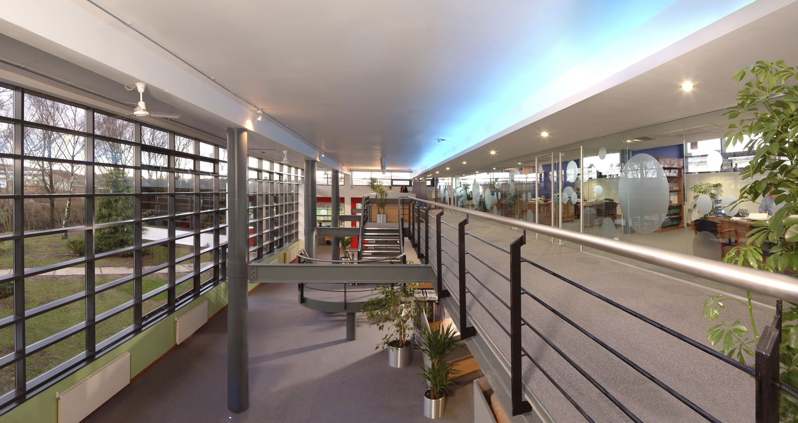 Commercial office interior taken looking over two floors with feature lighting
