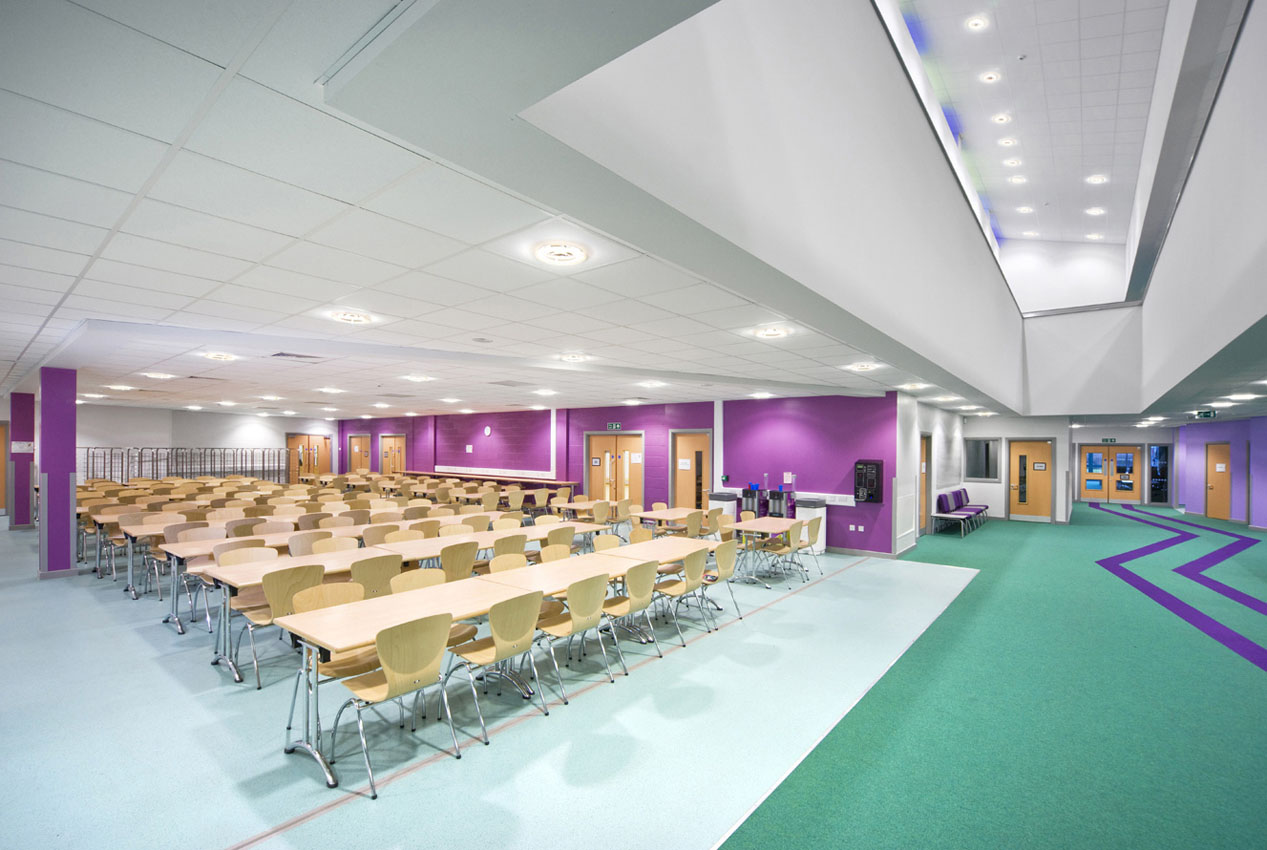 Commercial interio with high ceiling and colourful flooring