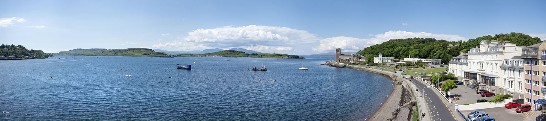 Panorama of a hotel and view across Oban Bay