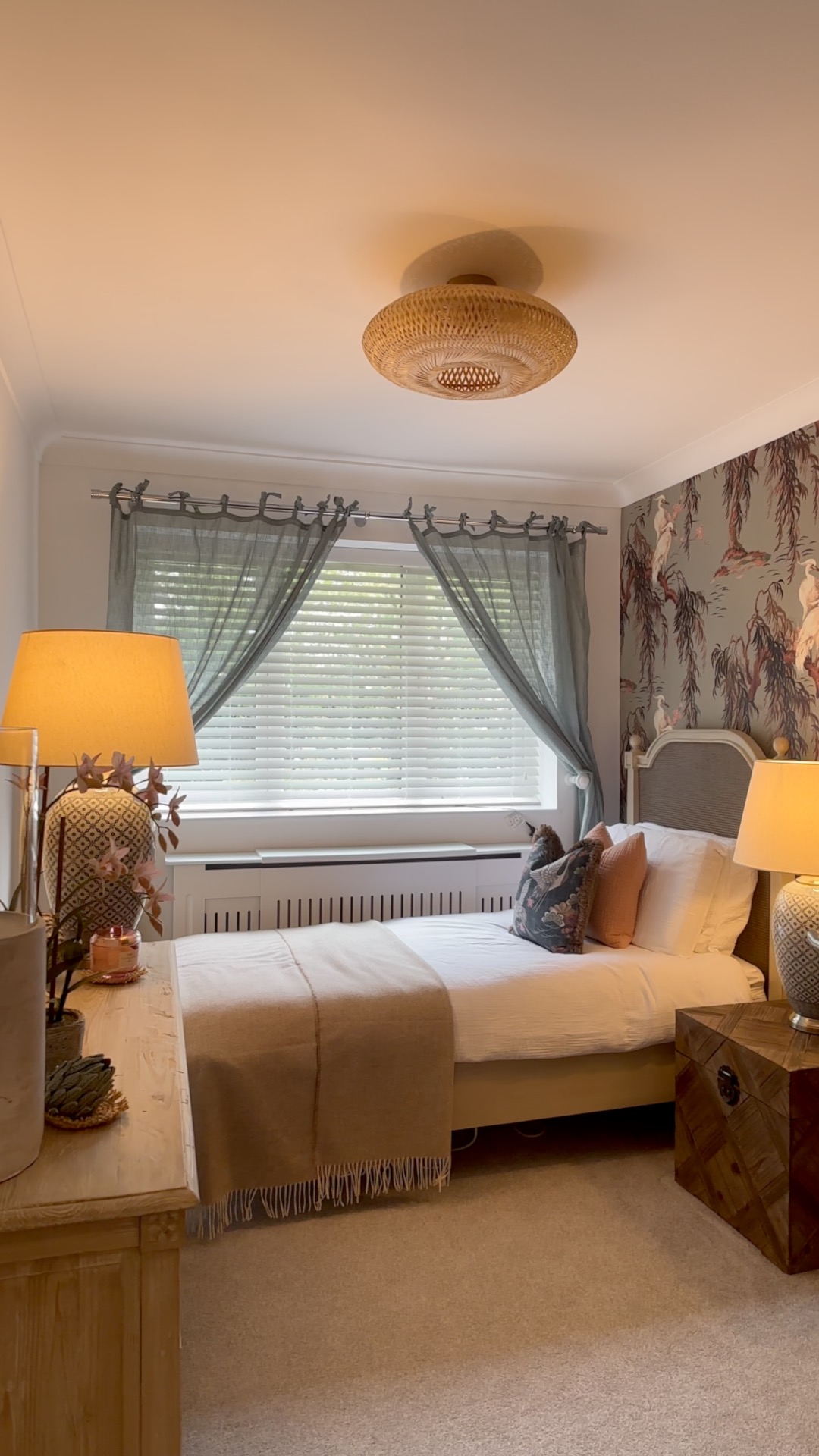 Bedroom with warm light from lamps and window detail