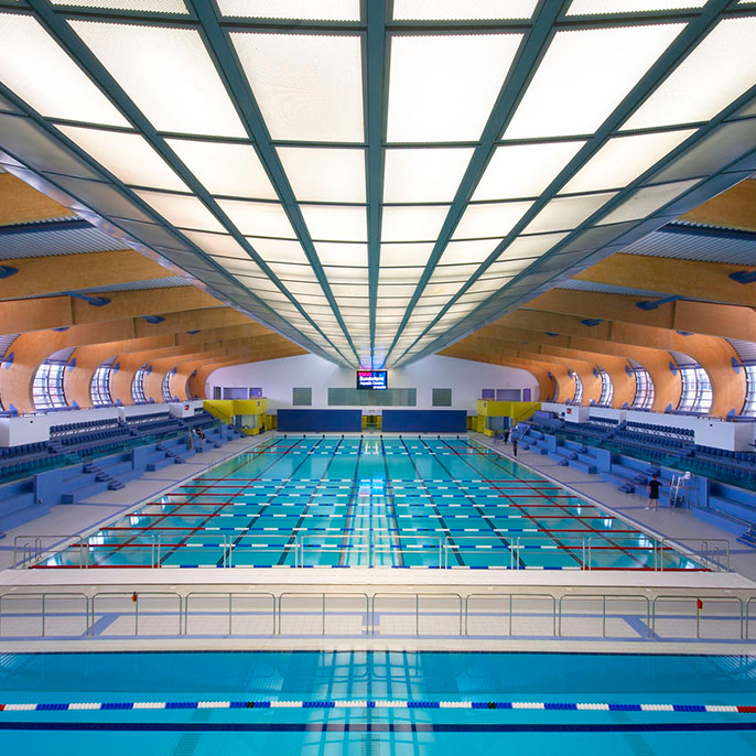 A wide view of Sunderland aquatic centre swimming pools with wooden beamed ceiling 