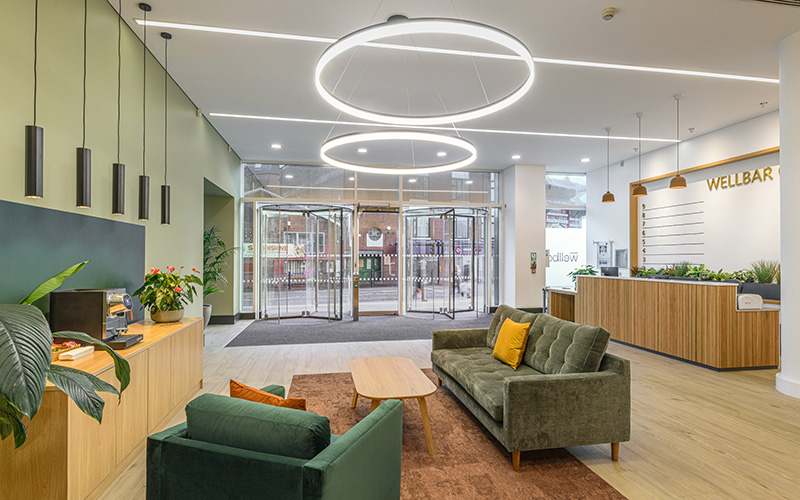 Receprion area in a commercial office building with seating and large glazed window