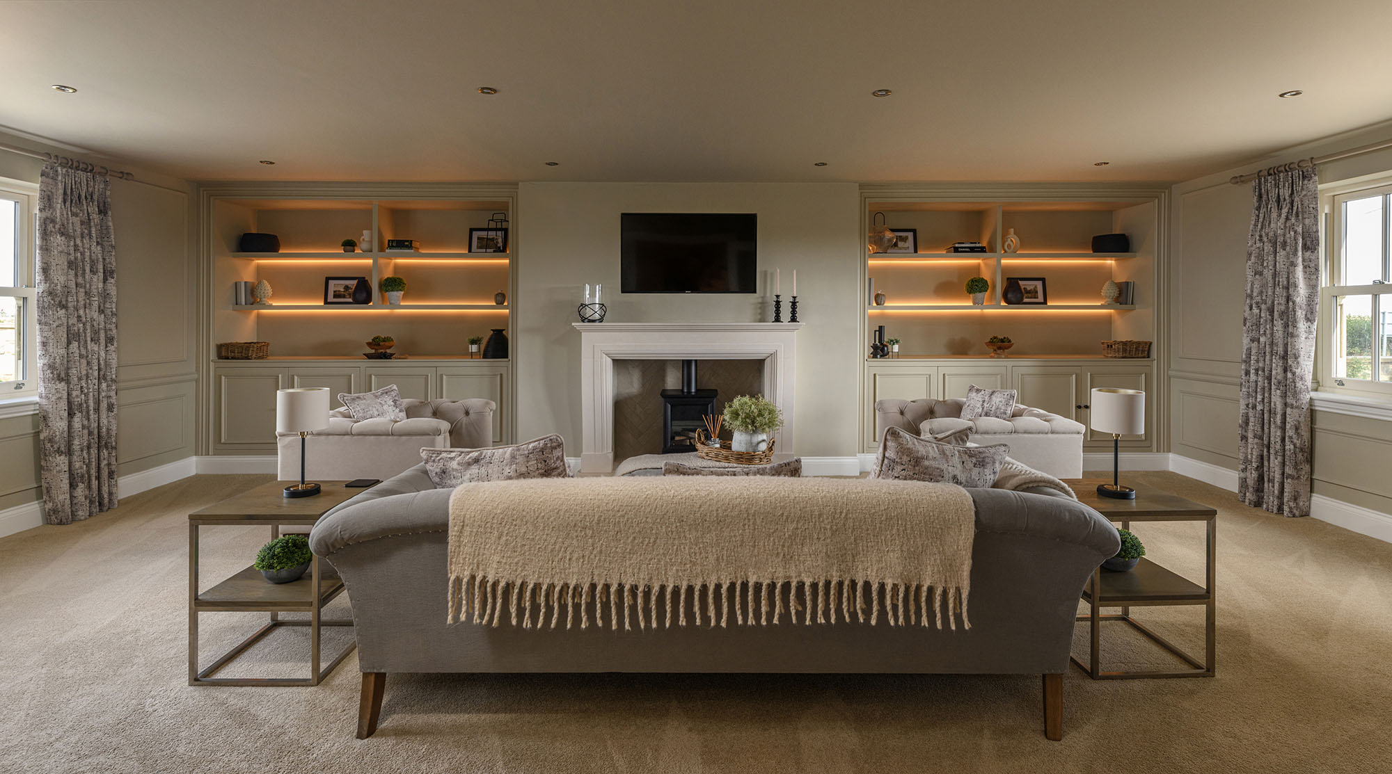 residential property interior with feature shelves, fireplace and furniture