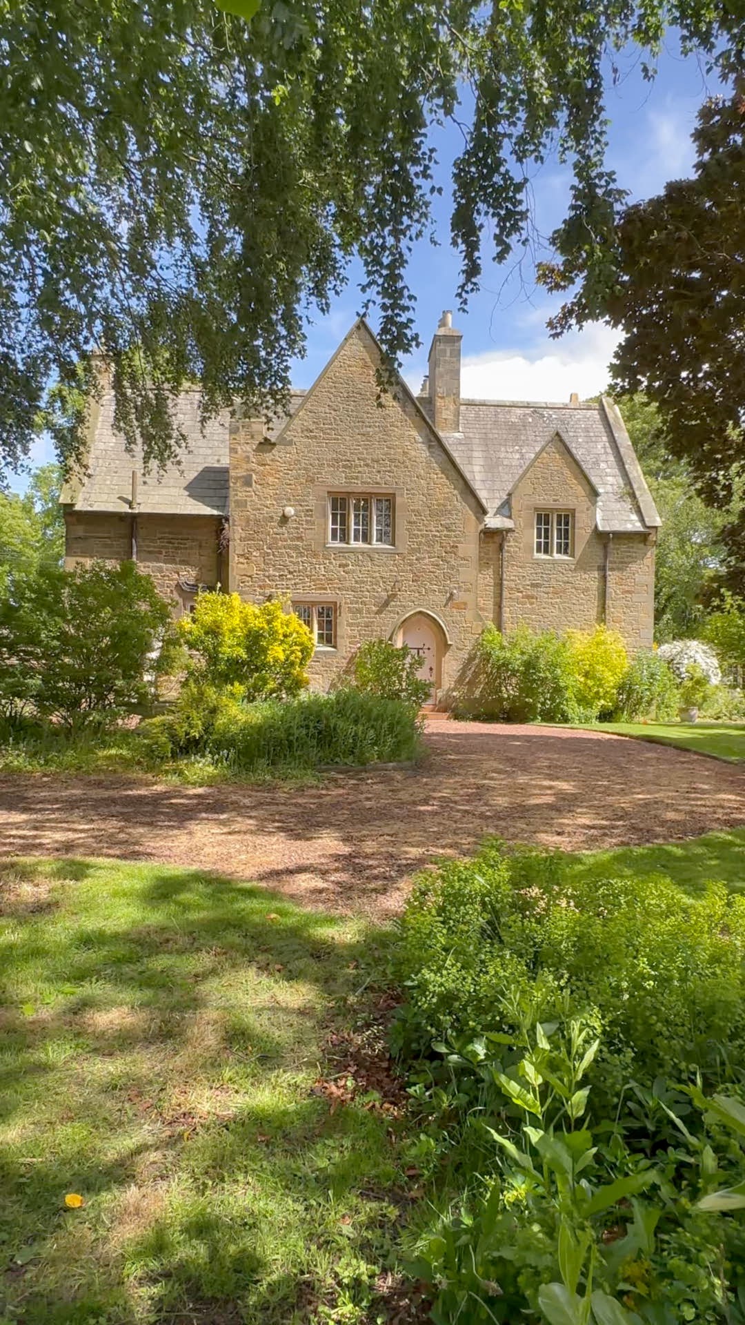 Residential property in sunshine with trees and dappled light